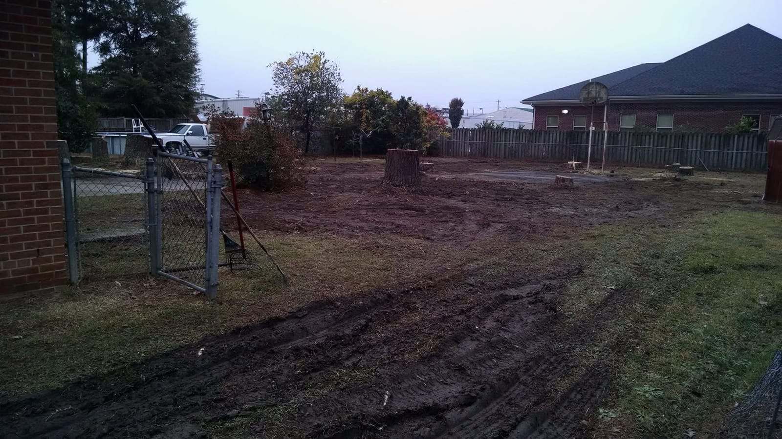 Backyard lot cleared of trees and brush, graded smooth by the Burks crew